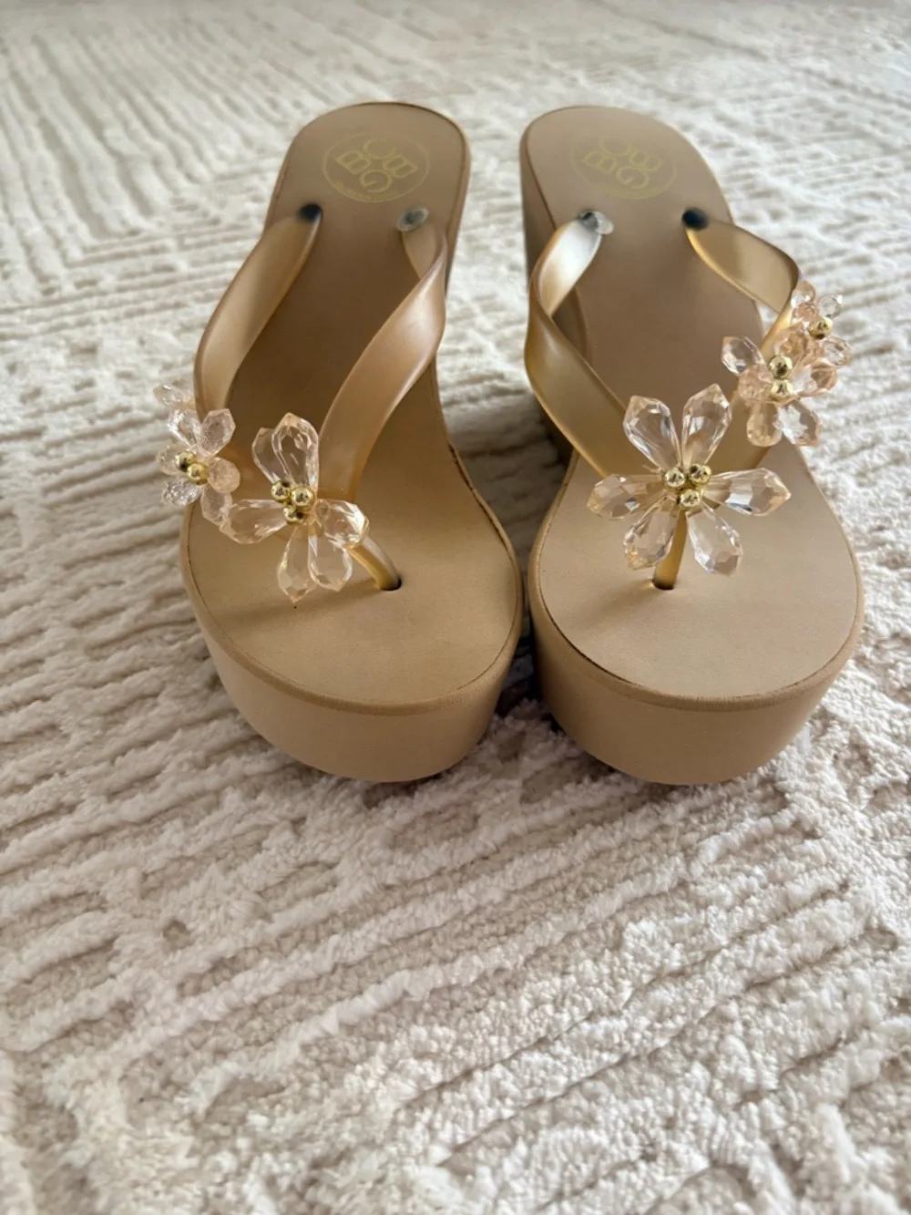 BCBG Tan Platform Flip Flop Sandals with Clear Floral Embellishments